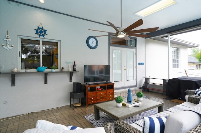 8760 Plantation Ridge Blvd, Lakeland, FL 33809 - living room with a textured wall, ceiling fan, and brick patterned floors