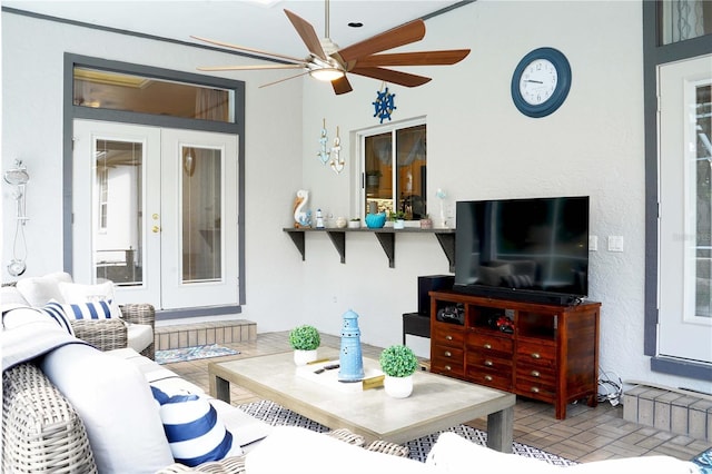 8760 Plantation Ridge Blvd, Lakeland, FL 33809 - living room with a ceiling fan, brick patterned floors, and french doors