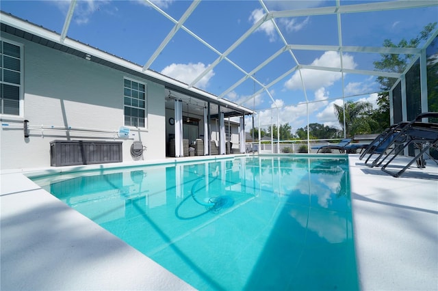 8760 Plantation Ridge Blvd, Lakeland, FL 33809 - swimming pool featuring a patio and glass enclosure