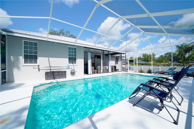 8760 Plantation Ridge Blvd, Lakeland, FL 33809 - view of pool with a patio area and glass enclosure