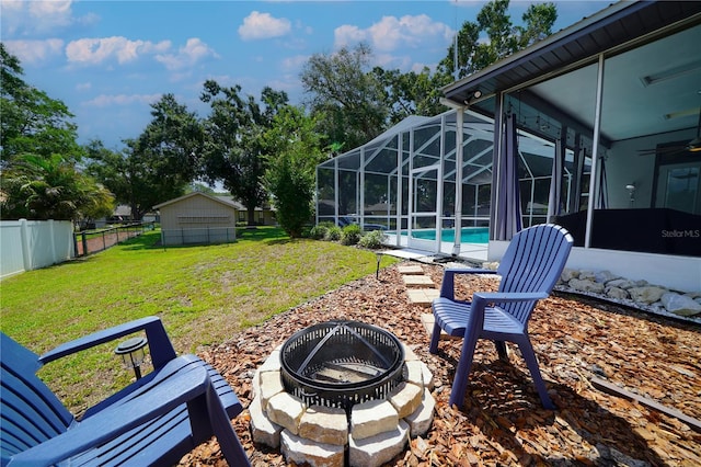 8760 Plantation Ridge Blvd, Lakeland, FL 33809 - view of yard featuring an outdoor fire pit, an outdoor pool, a lanai, a ceiling fan, and a patio