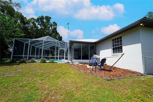 8760 Plantation Ridge Blvd, Lakeland, FL 33809 - rear view of property featuring stucco siding, a yard, a lanai, and an outdoor pool