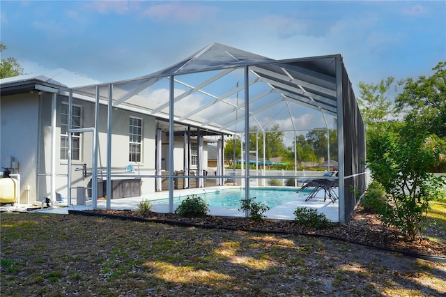 8760 Plantation Ridge Blvd, Lakeland, FL 33809 - swimming pool featuring glass enclosure and a patio area