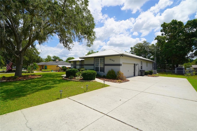 8760 Plantation Ridge Blvd, Lakeland, FL 33809 - view of front of house featuring a garage, concrete driveway, and stucco siding
