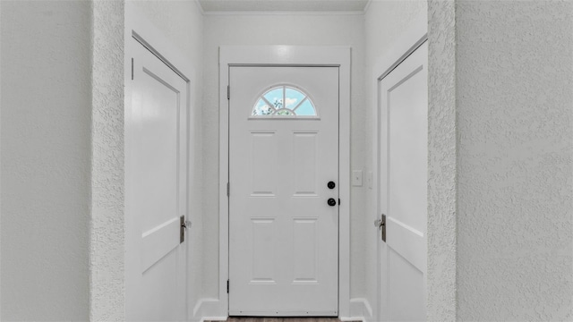 725 Ave B SW, Winter Haven, FL 33880 - doorway with a textured wall and ornamental molding