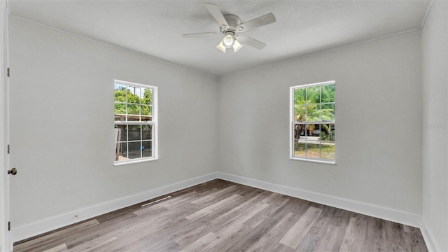 725 Ave B SW, Winter Haven, FL 33880 - empty room featuring wood finished floors, ceiling fan, and baseboards