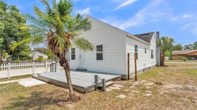 725 Ave B SW, Winter Haven, FL 33880 - rear view of house featuring fence and a deck