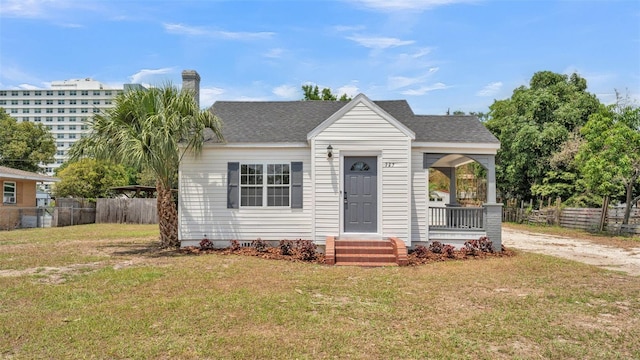725 Ave B SW, Winter Haven, FL 33880 - view of front of home with a porch, a chimney, and a shingled roof