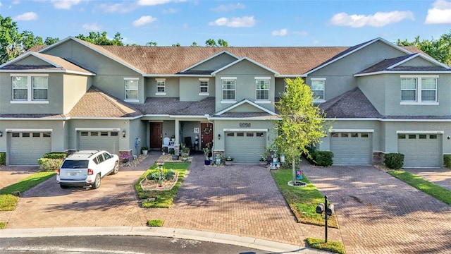 6435 Sedgeford Dr, Lakeland, FL 33811 - townhome / multi-family property featuring stucco siding, driveway, and an attached garage