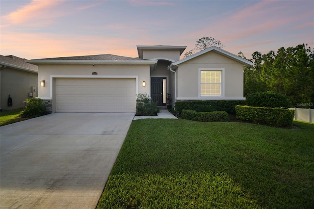 15354 Sweet Springs Bnd, Odessa, FL 33556 - view of front of property featuring stucco siding, an attached garage, concrete driveway, and a front lawn