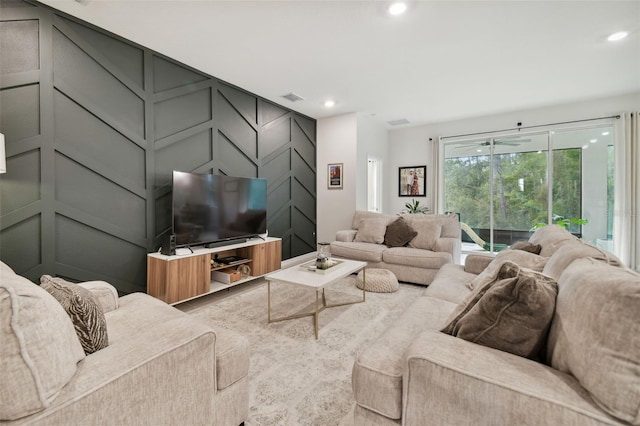 15354 Sweet Springs Bnd, Odessa, FL 33556 - living area with a decorative wall, recessed lighting, and a sunroom