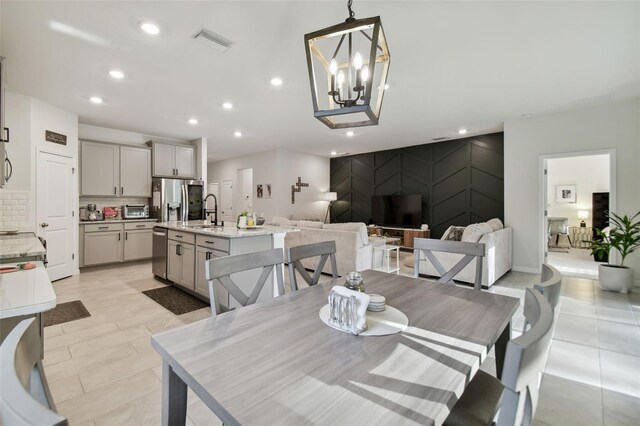 15354 Sweet Springs Bnd, Odessa, FL 33556 - dining space with recessed lighting, a chandelier, and light tile patterned flooring