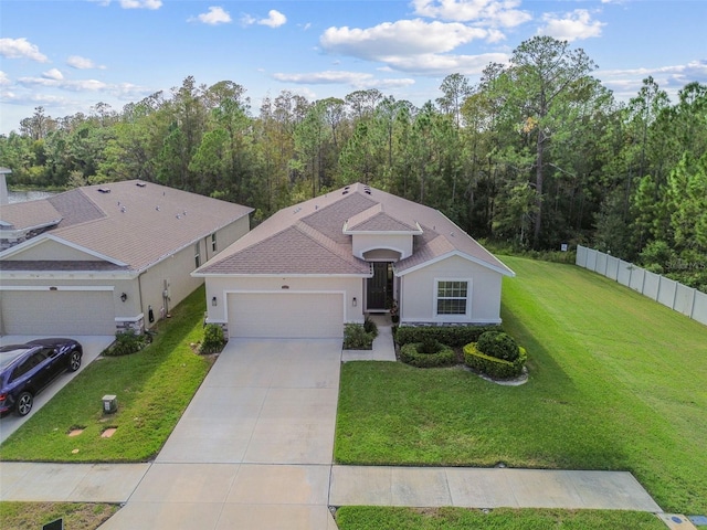 15354 Sweet Springs Bnd, Odessa, FL 33556 - single story home featuring a garage, stucco siding, driveway, and a wooded view