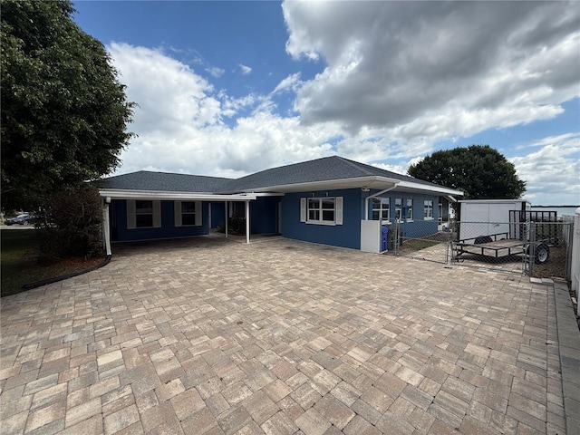 1328 Edgewater Beach Dr, Lakeland, FL 33805 - view of front facade featuring fence, a carport, and a gate