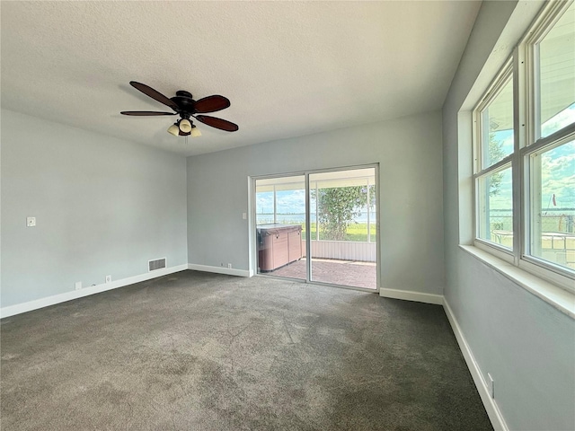 1328 Edgewater Beach Dr, Lakeland, FL 33805 - carpeted spare room featuring baseboards, ceiling fan, and a textured ceiling