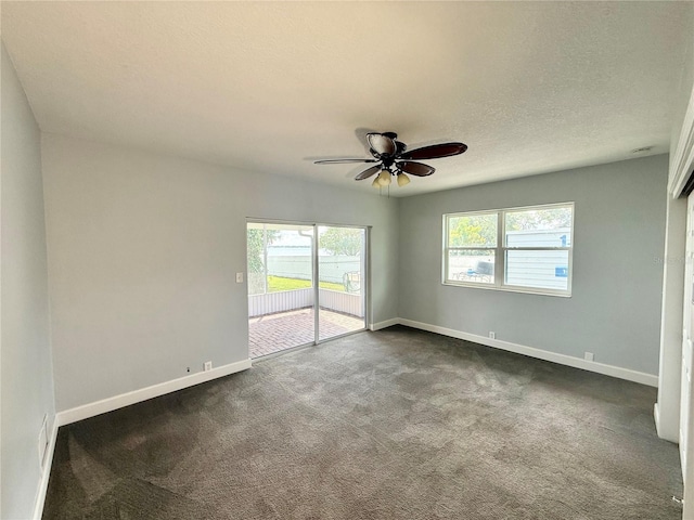 1328 Edgewater Beach Dr, Lakeland, FL 33805 - unfurnished room with dark colored carpet, plenty of natural light, and ceiling fan