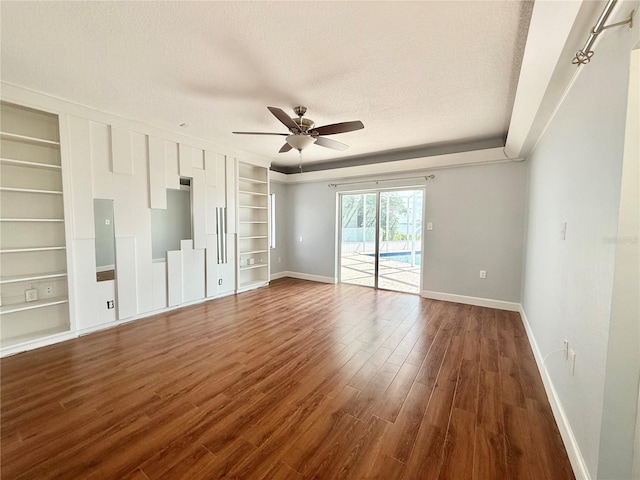 1328 Edgewater Beach Dr, Lakeland, FL 33805 - unfurnished bedroom with access to exterior, baseboards, a textured ceiling, dark wood-type flooring, and ceiling fan