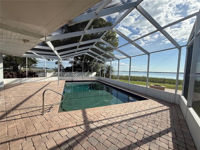 1328 Edgewater Beach Dr, Lakeland, FL 33805 - view of swimming pool with a patio area, a lanai, and a water view