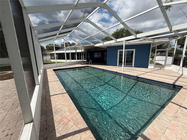 1328 Edgewater Beach Dr, Lakeland, FL 33805 - swimming pool featuring a patio and glass enclosure