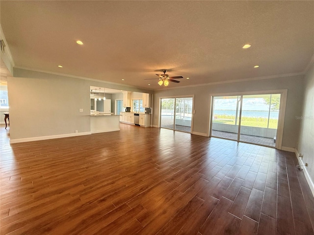 1328 Edgewater Beach Dr, Lakeland, FL 33805 - unfurnished living room with crown molding, a ceiling fan, baseboards, dark wood-type flooring, and recessed lighting