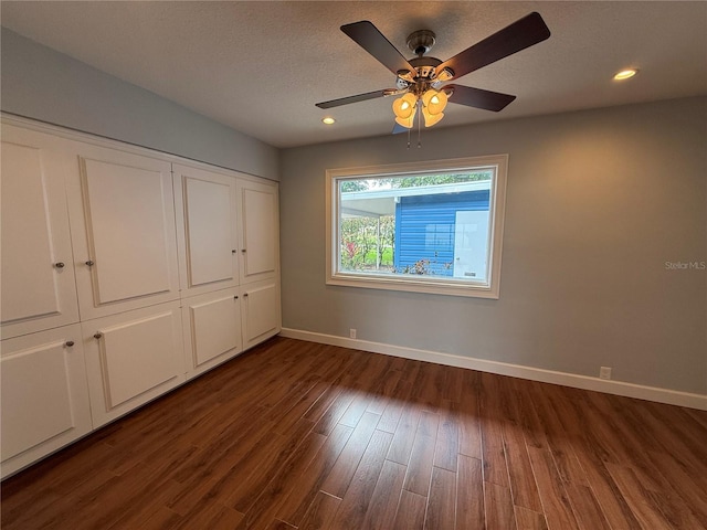 1328 Edgewater Beach Dr, Lakeland, FL 33805 - unfurnished bedroom with dark wood-type flooring, baseboards, a closet, recessed lighting, and ceiling fan