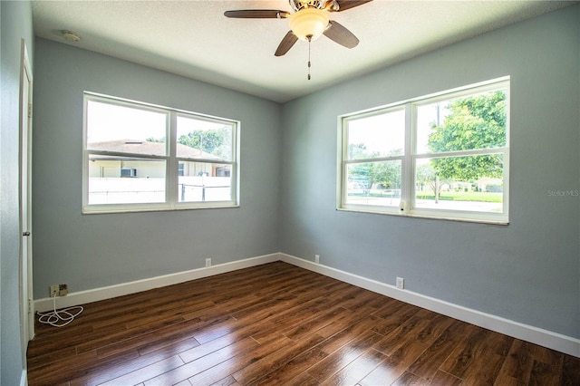 1328 Edgewater Beach Dr, Lakeland, FL 33805 - empty room with a smoke detector, dark wood-type flooring, and a ceiling fan