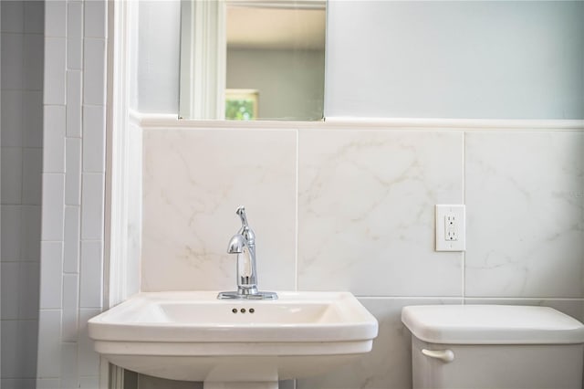 1328 Edgewater Beach Dr, Lakeland, FL 33805 - half bathroom with tile walls and a sink