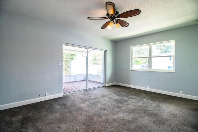 1328 Edgewater Beach Dr, Lakeland, FL 33805 - empty room featuring ceiling fan, a textured ceiling, and dark colored carpet
