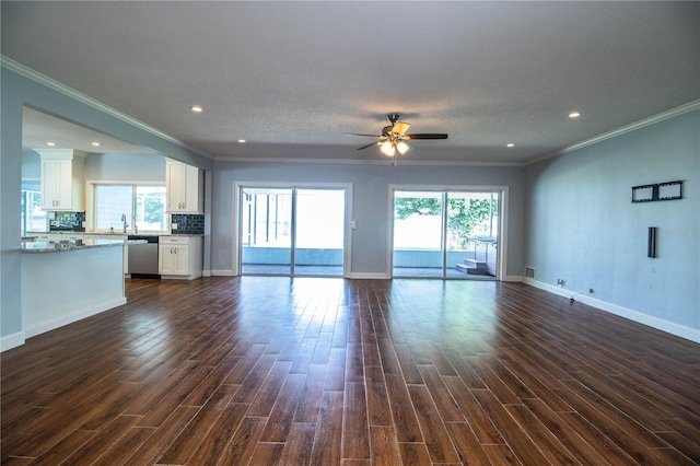 1328 Edgewater Beach Dr, Lakeland, FL 33805 - unfurnished living room with ceiling fan, dark wood-style flooring, ornamental molding, plenty of natural light, and recessed lighting