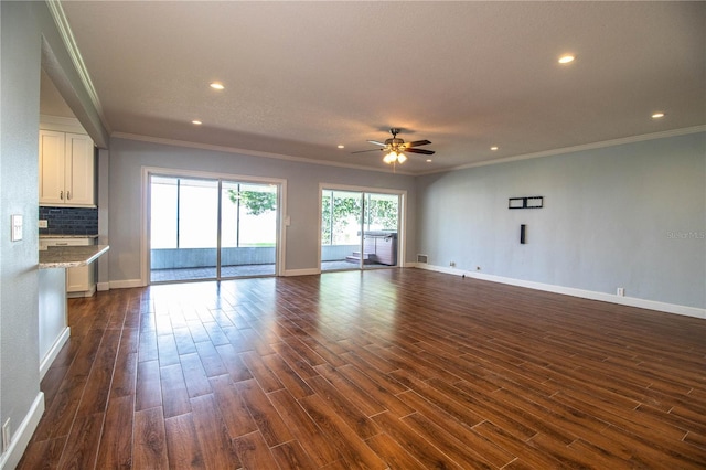 1328 Edgewater Beach Dr, Lakeland, FL 33805 - unfurnished living room featuring ornamental molding, a ceiling fan, dark wood-style flooring, and recessed lighting