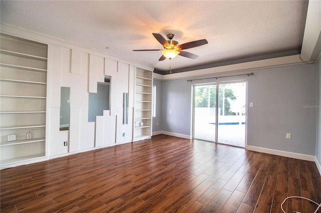 1328 Edgewater Beach Dr, Lakeland, FL 33805 - empty room with built in features, ceiling fan, dark wood finished floors, and a textured ceiling