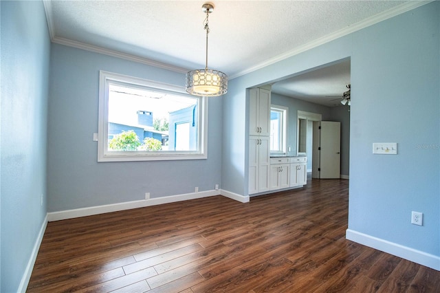 1328 Edgewater Beach Dr, Lakeland, FL 33805 - spare room featuring dark wood-style floors, crown molding, ceiling fan, and a textured ceiling