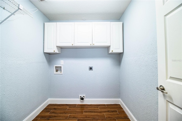 1328 Edgewater Beach Dr, Lakeland, FL 33805 - laundry area featuring electric dryer hookup, hookup for a washing machine, dark wood-type flooring, and cabinet space