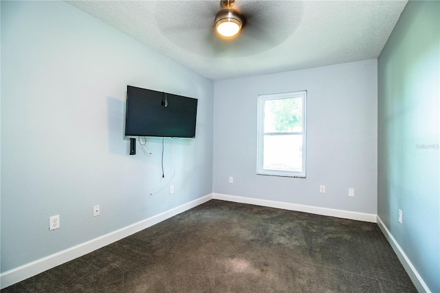 1328 Edgewater Beach Dr, Lakeland, FL 33805 - empty room with a ceiling fan, dark colored carpet, and a textured ceiling