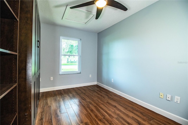 1328 Edgewater Beach Dr, Lakeland, FL 33805 - unfurnished room with dark wood finished floors, ceiling fan, and attic access
