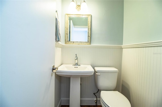 1328 Edgewater Beach Dr, Lakeland, FL 33805 - bathroom with toilet and wainscoting