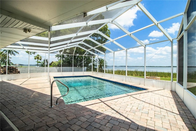 1328 Edgewater Beach Dr, Lakeland, FL 33805 - view of swimming pool featuring a patio, a water view, and a lanai