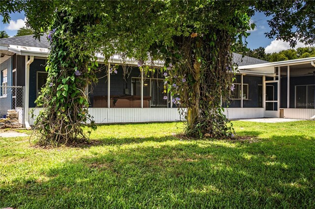 1328 Edgewater Beach Dr, Lakeland, FL 33805 - view of green lawn featuring a sunroom