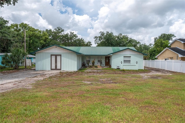 2219 New Jersey Rd, Lakeland, FL 33803 - view of front of property with french doors and metal roof