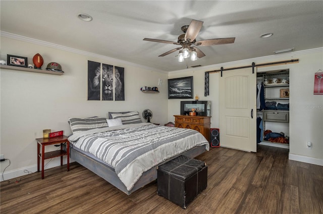 2219 New Jersey Rd, Lakeland, FL 33803 - bedroom featuring a barn door, wood finished floors, baseboards, and ornamental molding