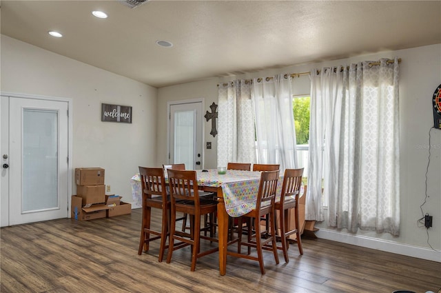 2219 New Jersey Rd, Lakeland, FL 33803 - dining room featuring wood finished floors, vaulted ceiling, recessed lighting, and baseboards