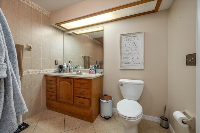 2219 New Jersey Rd, Lakeland, FL 33803 - bathroom featuring vanity, tile patterned floors, toilet, and tile walls