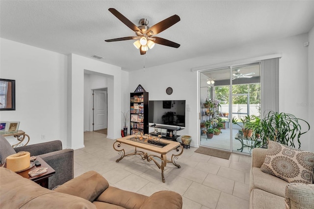 280 Pershing St, Bartow, FL 33830 - living area featuring ceiling fan, light tile patterned flooring, and a textured ceiling