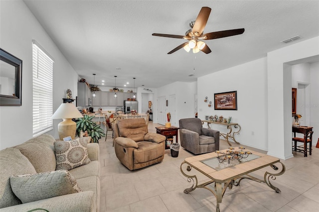 280 Pershing St, Bartow, FL 33830 - living room with a ceiling fan, healthy amount of natural light, light tile patterned floors, and a textured ceiling