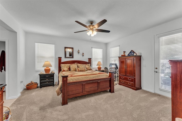 280 Pershing St, Bartow, FL 33830 - bedroom with light carpet, multiple windows, access to exterior, and a textured ceiling
