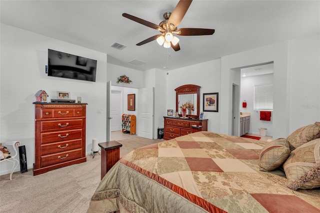 280 Pershing St, Bartow, FL 33830 - bedroom featuring light carpet, a ceiling fan, connected bathroom, and baseboards