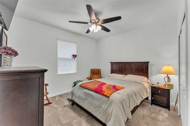 280 Pershing St, Bartow, FL 33830 - bedroom featuring light carpet, baseboards, and ceiling fan