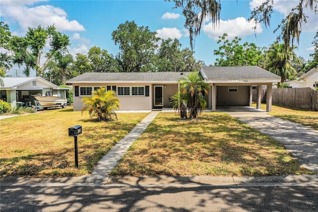 view of front of property featuring driveway and a carport