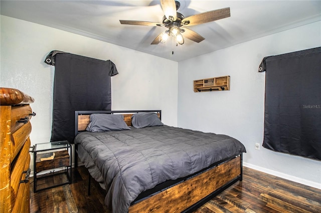 bedroom featuring hardwood / wood-style floors, baseboards, and ceiling fan