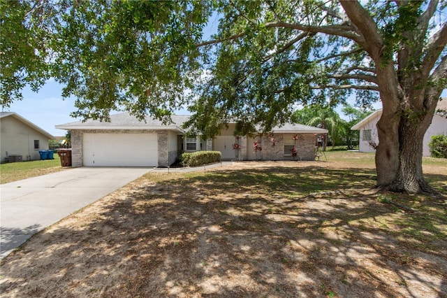 790 Chelsea Way, Lake Wales, FL 33853 - ranch-style house featuring driveway, a garage, and brick siding
